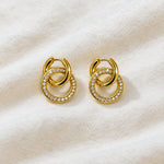 Gold hoop earrings on a white background