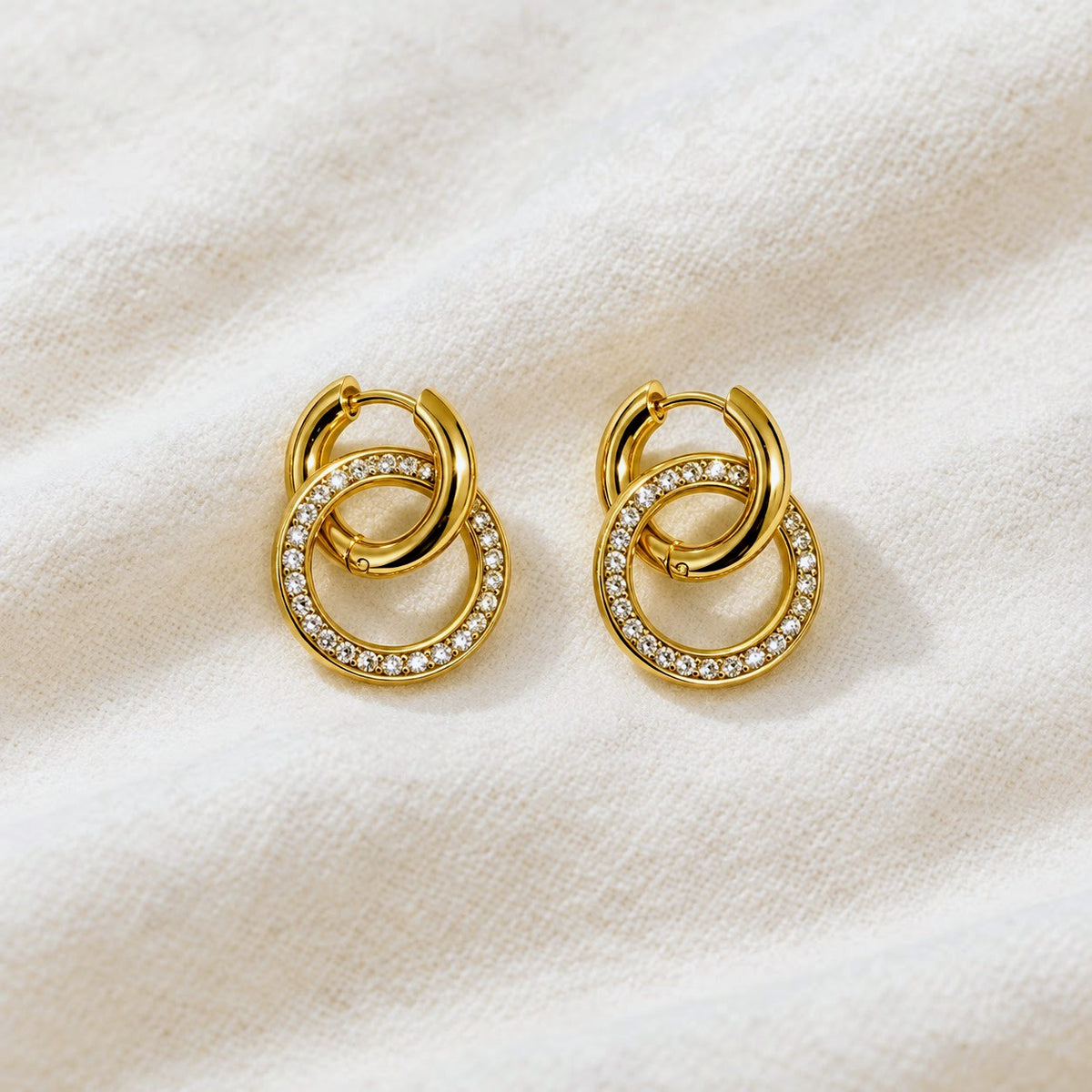 Gold hoop earrings on a white background