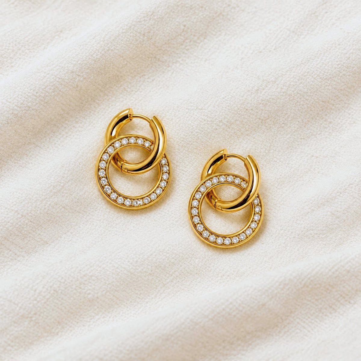 Gold hoop earrings on a white background