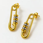 A pair of gold safety-pin stud earrings with a white background